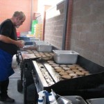 Lions club serving hamburgers at project connect 