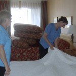 Mandy Farmer & Joan making a bed at the Accent Inn Victoria Hotel