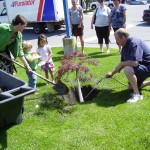 Mandy farmer and team tree planting at accent inns kelowna hotel