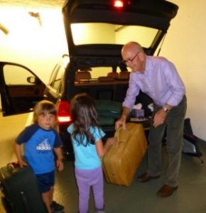 Terry farmer's Grandkids helping Granpa to load car