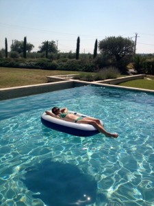 Mandy farmer of Accent Inns relaxing in the pool on vacation