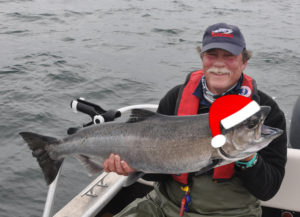 author-with-chinook-salmon-with-santa-hat